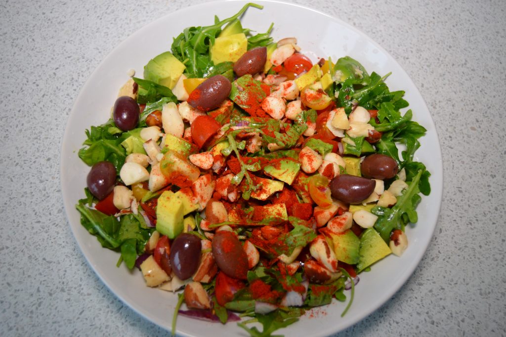 Rocket and Brazil Nut Mediterranean Salad on a bowl