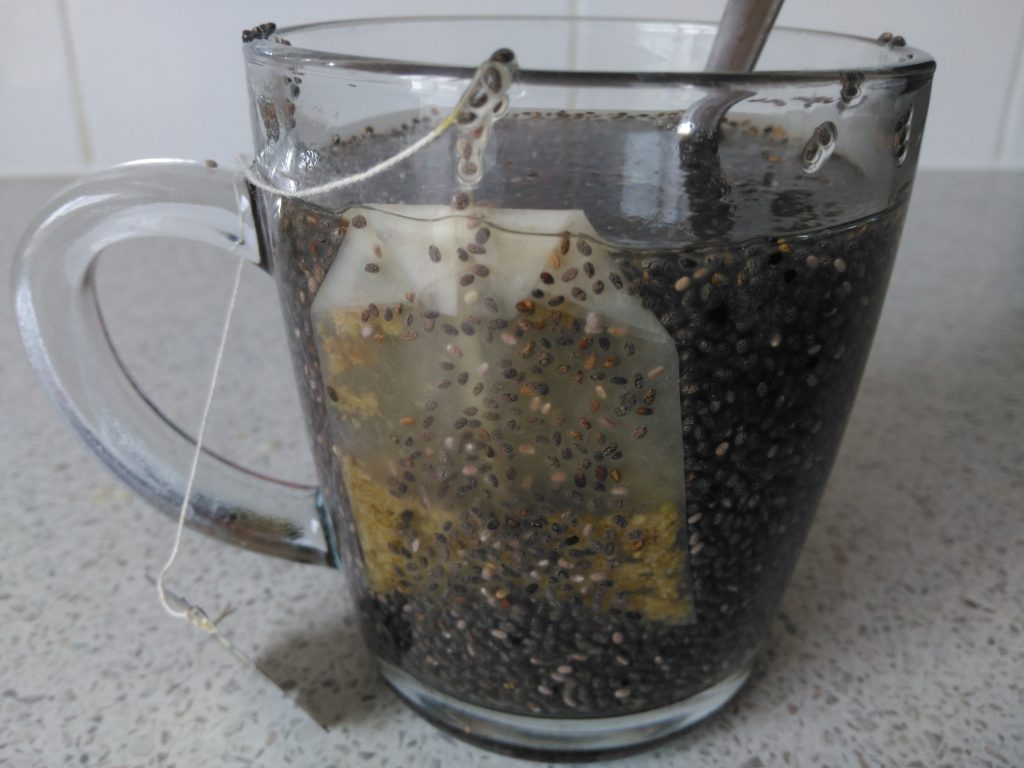 White tea and chia face mask in a glass mug