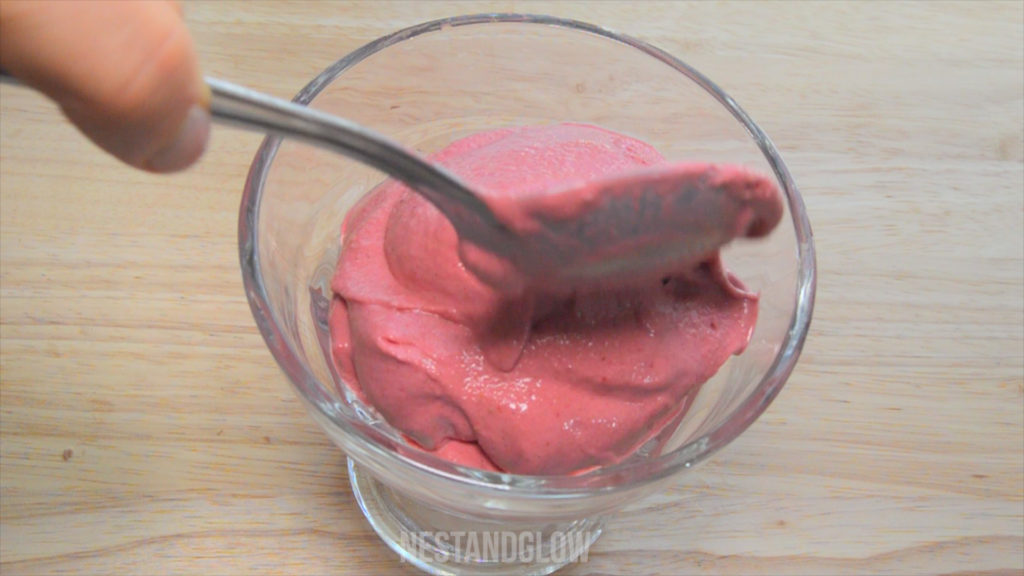 Serving healthy strawberry cashew ice cream in a bowl. this churn free healthy ice cream is so quick to make