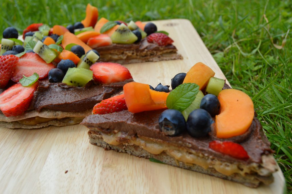 healthy dessert pizza with caramel oozing out