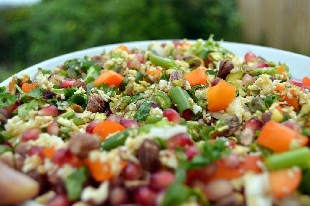 cauliflower cous cous crunch close up full of fruit and nuts. A healthy couscous salad that's perfect for summer meals outside.