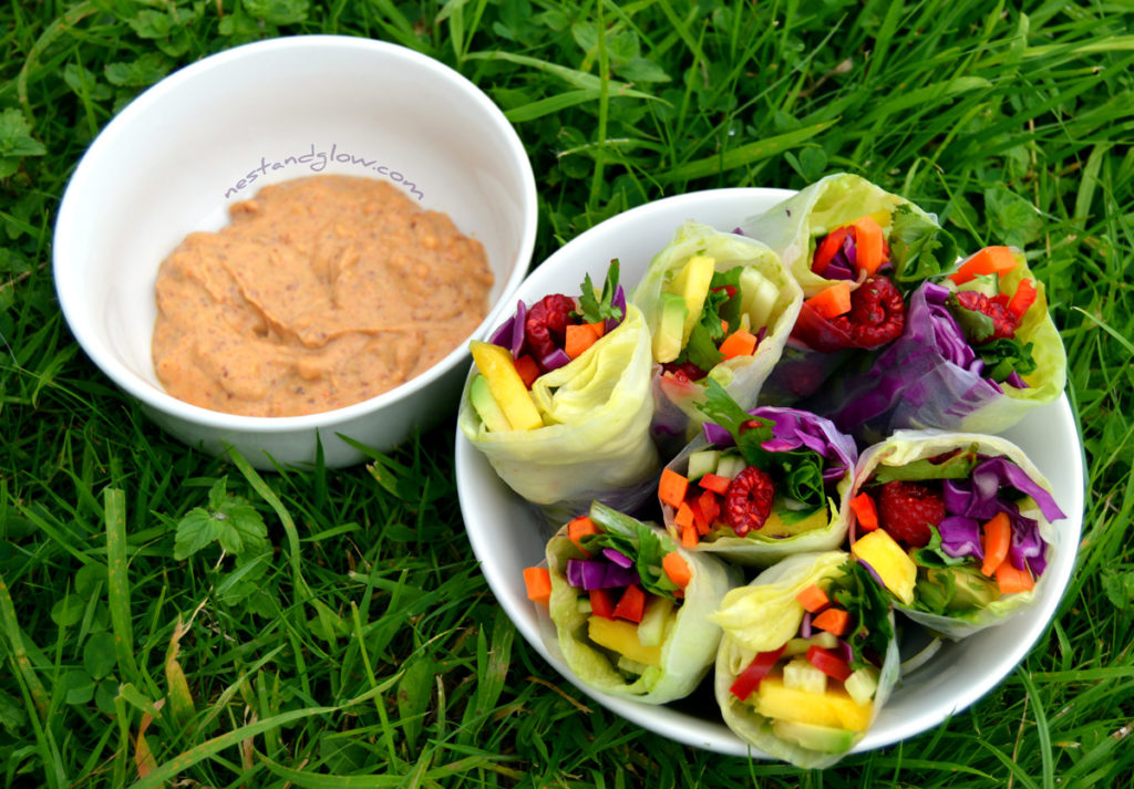 Rainbow summer rolls with a spicy lemon dip make the perfect side dish in warm weather. A nut dip sauce adds protein and healthy fats.