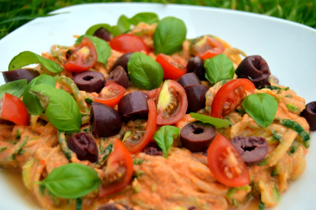 Creamy tomato Courgette Spaghetti topped with black olives