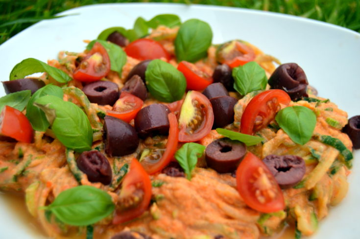 Creamy tomato Courgette Spaghetti topped with black olives