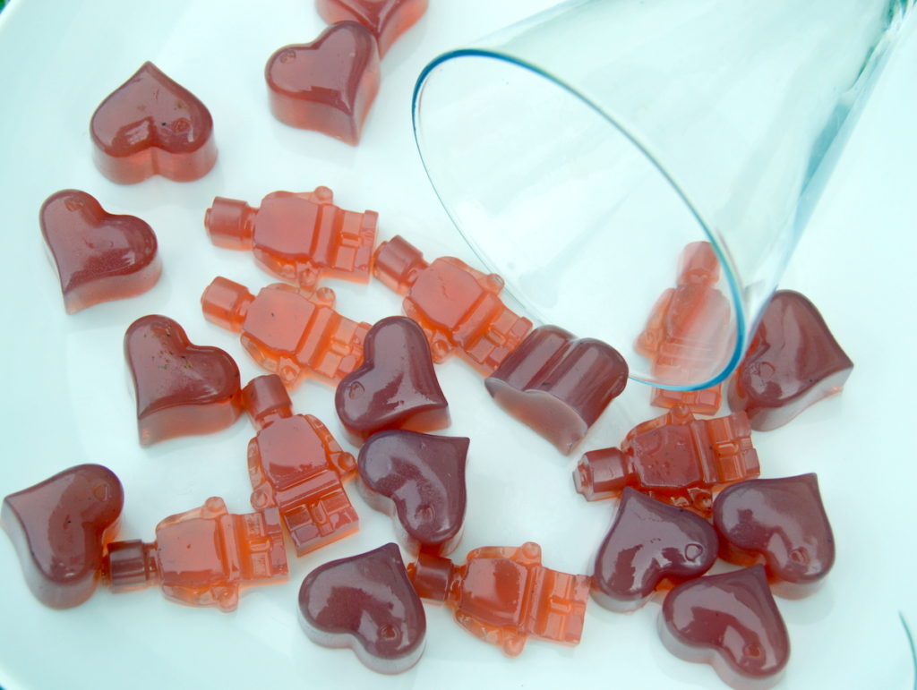 Vegetarian Rose Gummy Sweets Falling Out of a wine glass