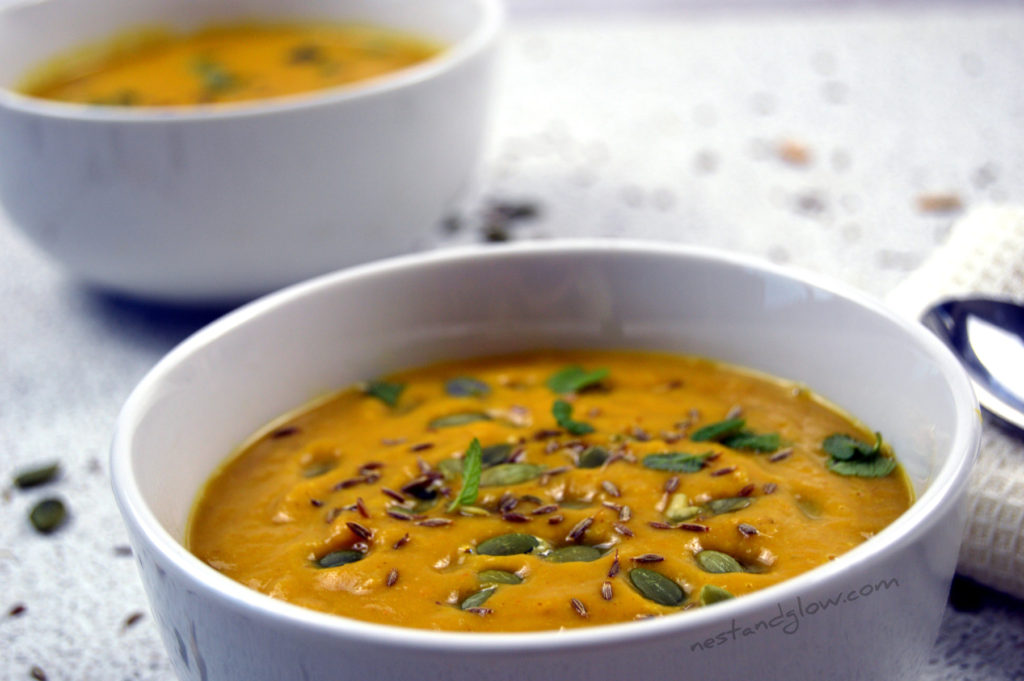 A bowl of roasted butternut squash soup with almond butter