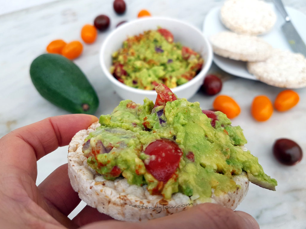 Easy delicious guacamole on a brown rice cake