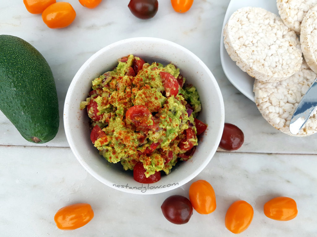 Easy delicious guacamole with black and yellow tomatoes