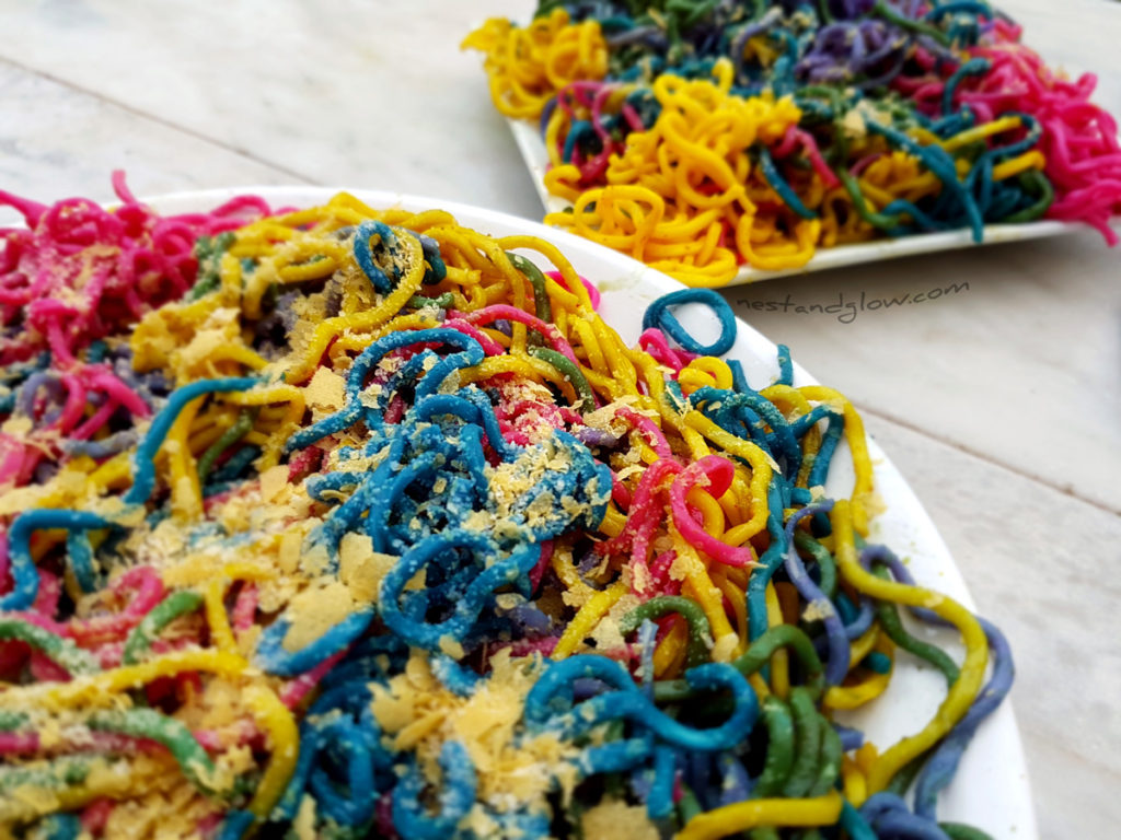 Plates of natural vegetable rainbow pasta - organic and easy recipe