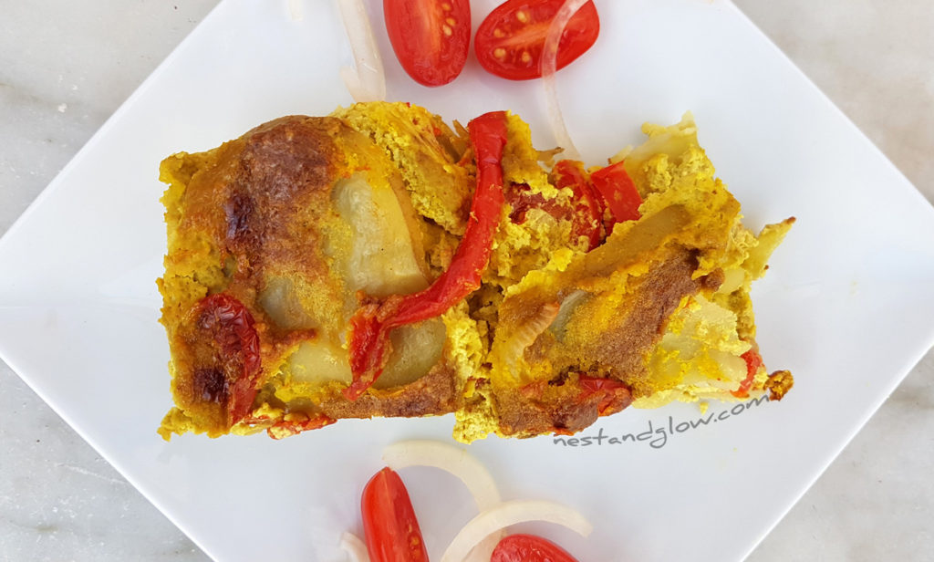 A slice of vegan cheese and tomato potato bake