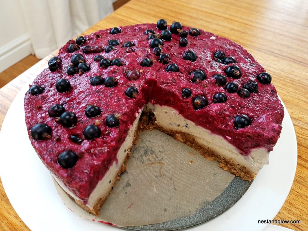 A large Blackcurrant Cashew Vegan Cheesecake