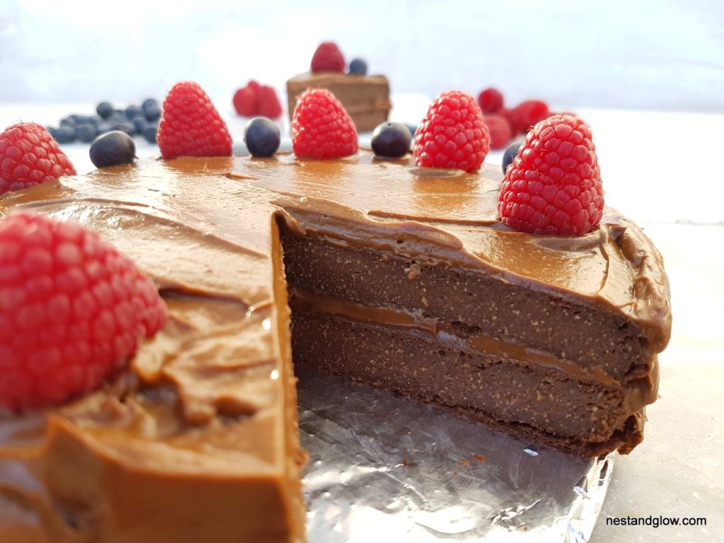 inside of a chocoalte quinoa cake with two layers and chocolate avocado frosting