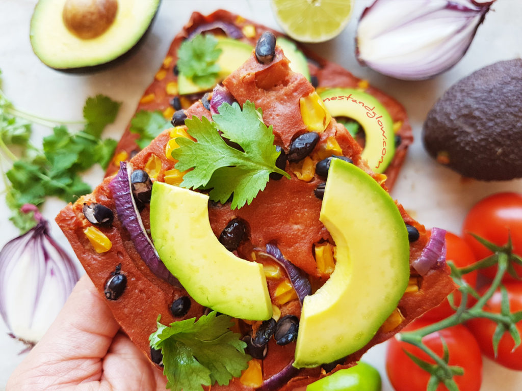 A slice of Mexican Quinoa Flatbread with avocado