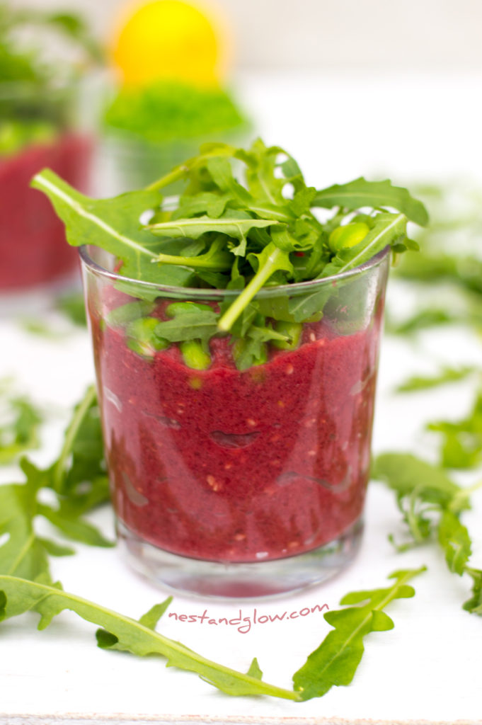 Rocket and broad beans on a beetroot and white bean dip