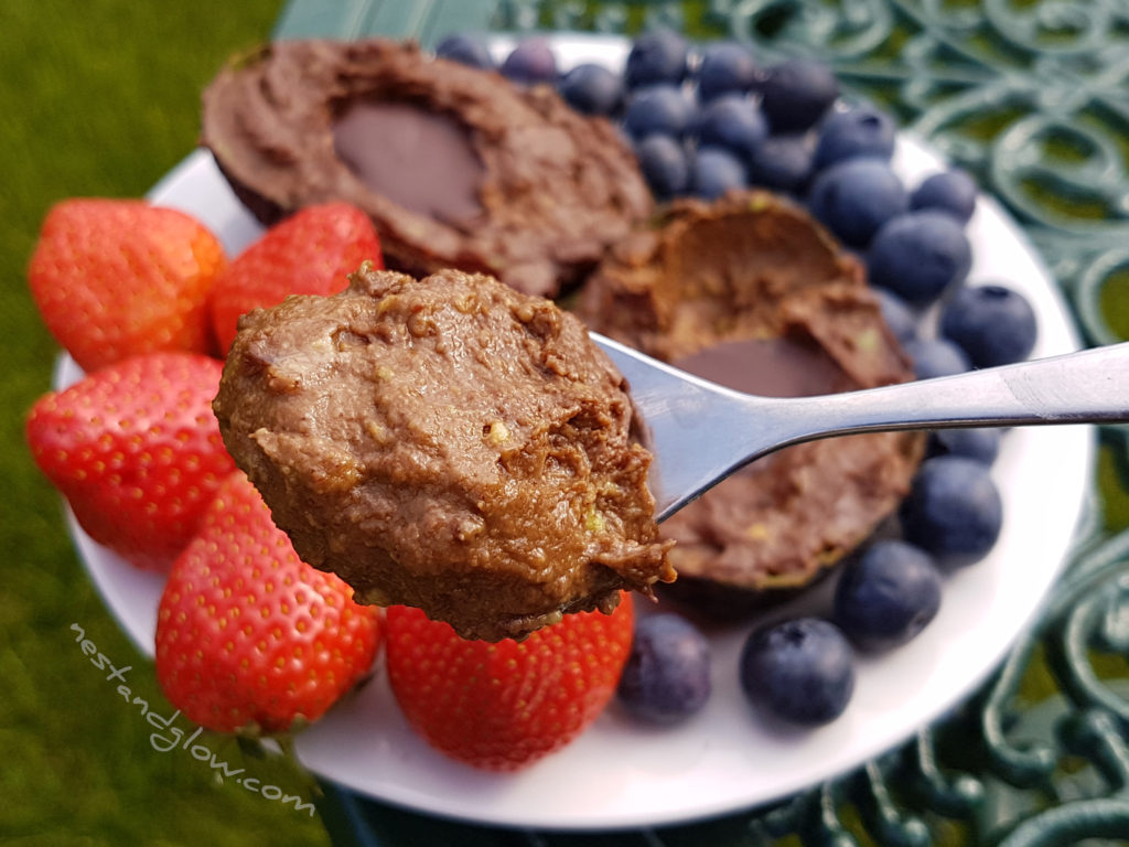 a spoonful of chocolate avocado nut pudding - vegan