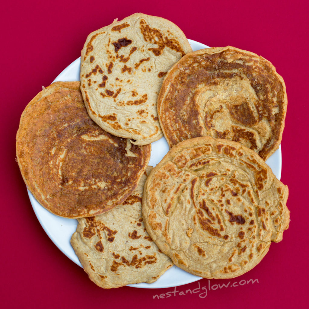 easy vegan healthy lentil pancakes on a plate. these protein pancakes look abit like naan bread and people have been known to use them for a main as they're wheat free and only slightly sweet.