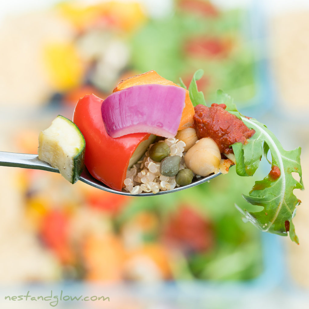 layered quinoa salad on spoon