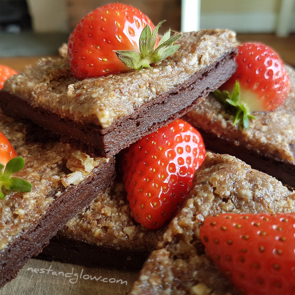 close up shot of healthy chocolate quinoa brownies on a plate. these vegan brownies are full of goodness
