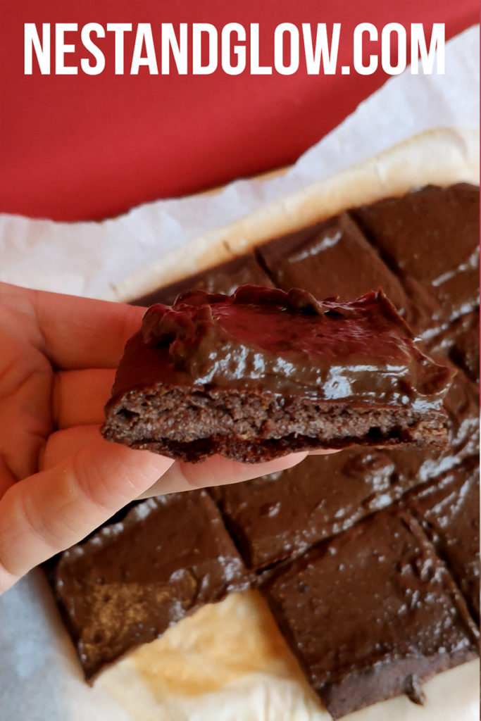 side view of my gluten free healthy brownie recipe thats topped with avocado cacao frosting. easy to make and full of wholefood ingredients