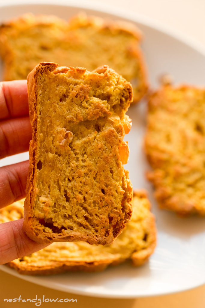 a slice of toasted cornbread made with chickpea flour and frozen sweet corn