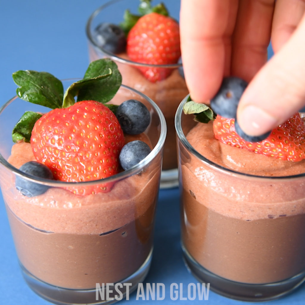 coconut chocolate mousse can be topped with whatever fruit you have. here i'm topping with berries including strawberries and blueberries